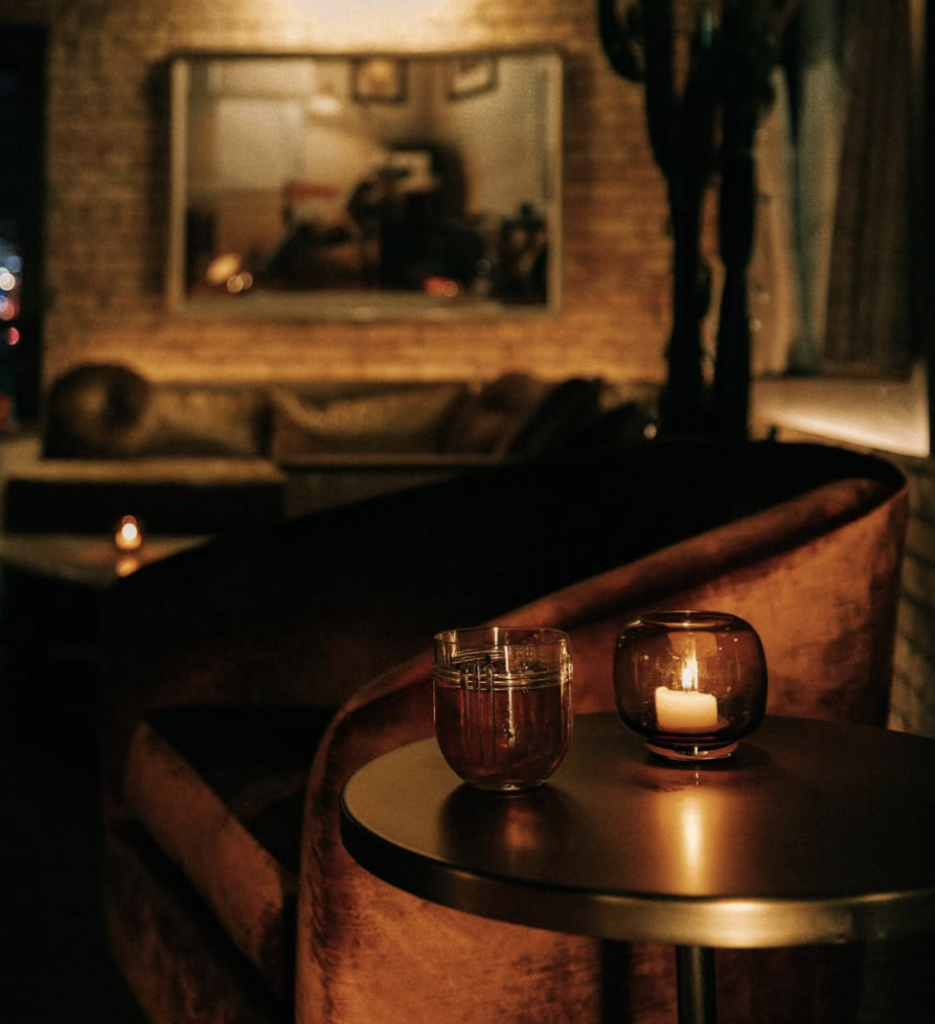 A candlelit corner at Marlow Bar, one of the best date night bars in Austin.